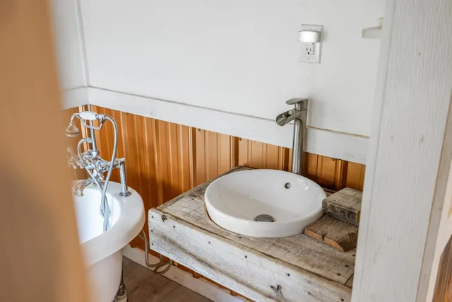 a bathroom with a sink and mirror