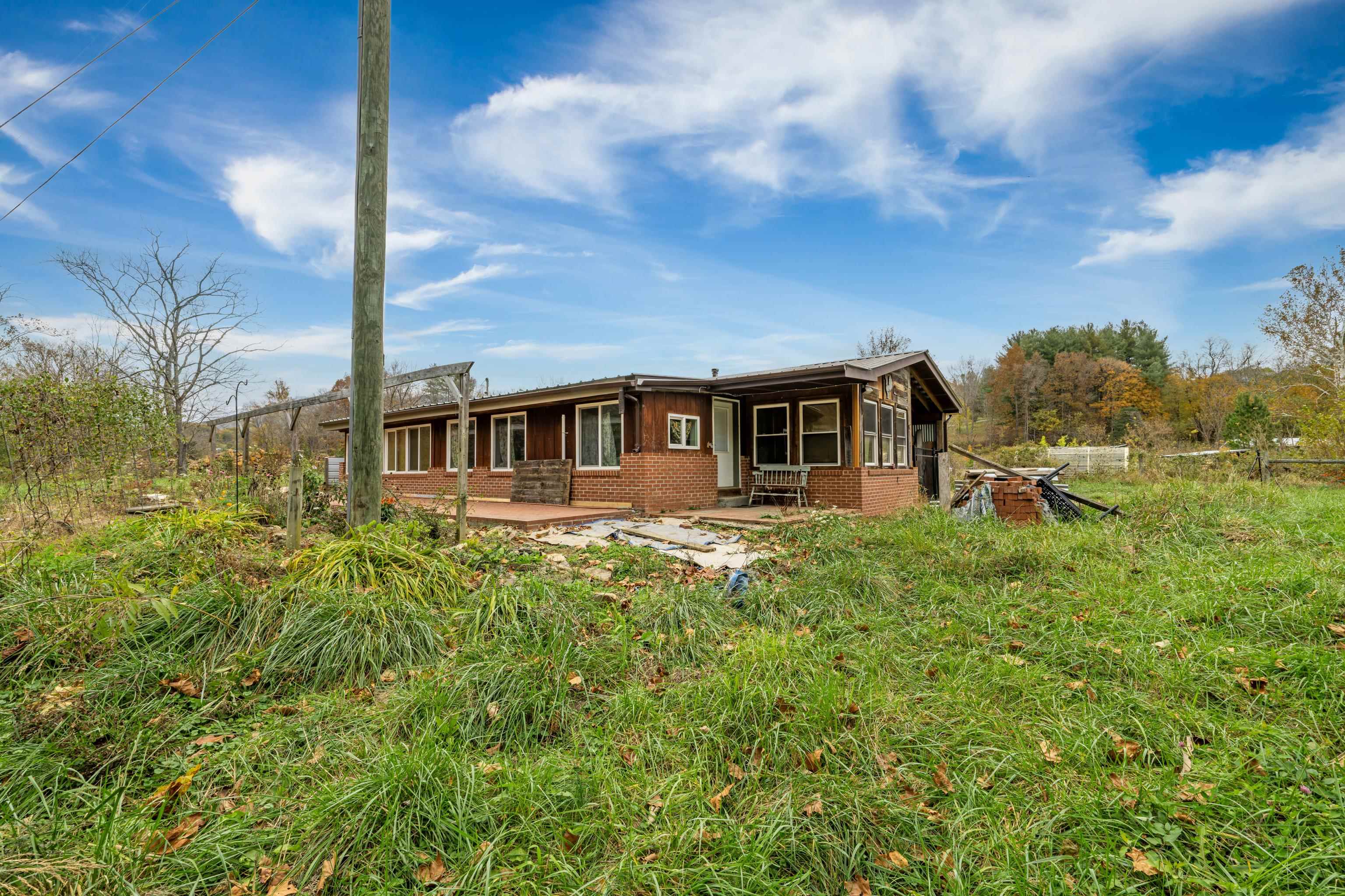 3441 West Midland Trail Lexington, VA 24450 - Photo 37 of 43 a view of a house with a backyard