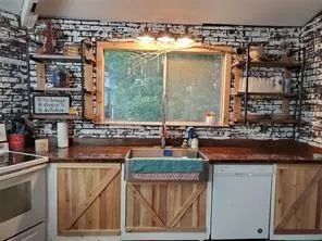 a kitchen with a sink and cabinets