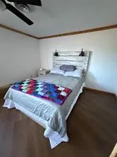 a bedroom with a bed and a dresser