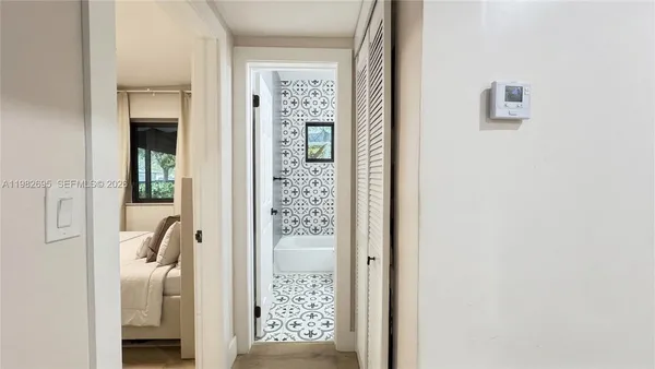 a bathroom with a toilet a sink and shower