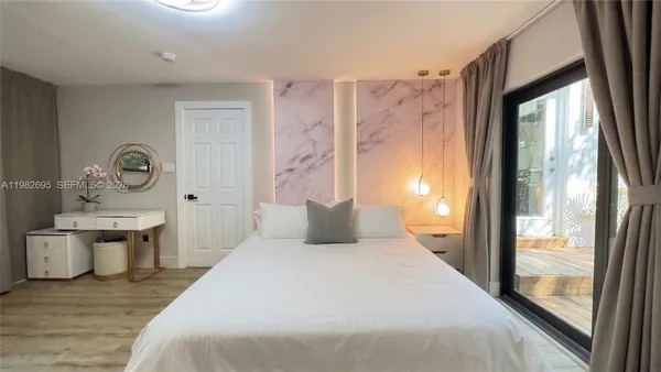 a view of a house with swimming pool and sitting area