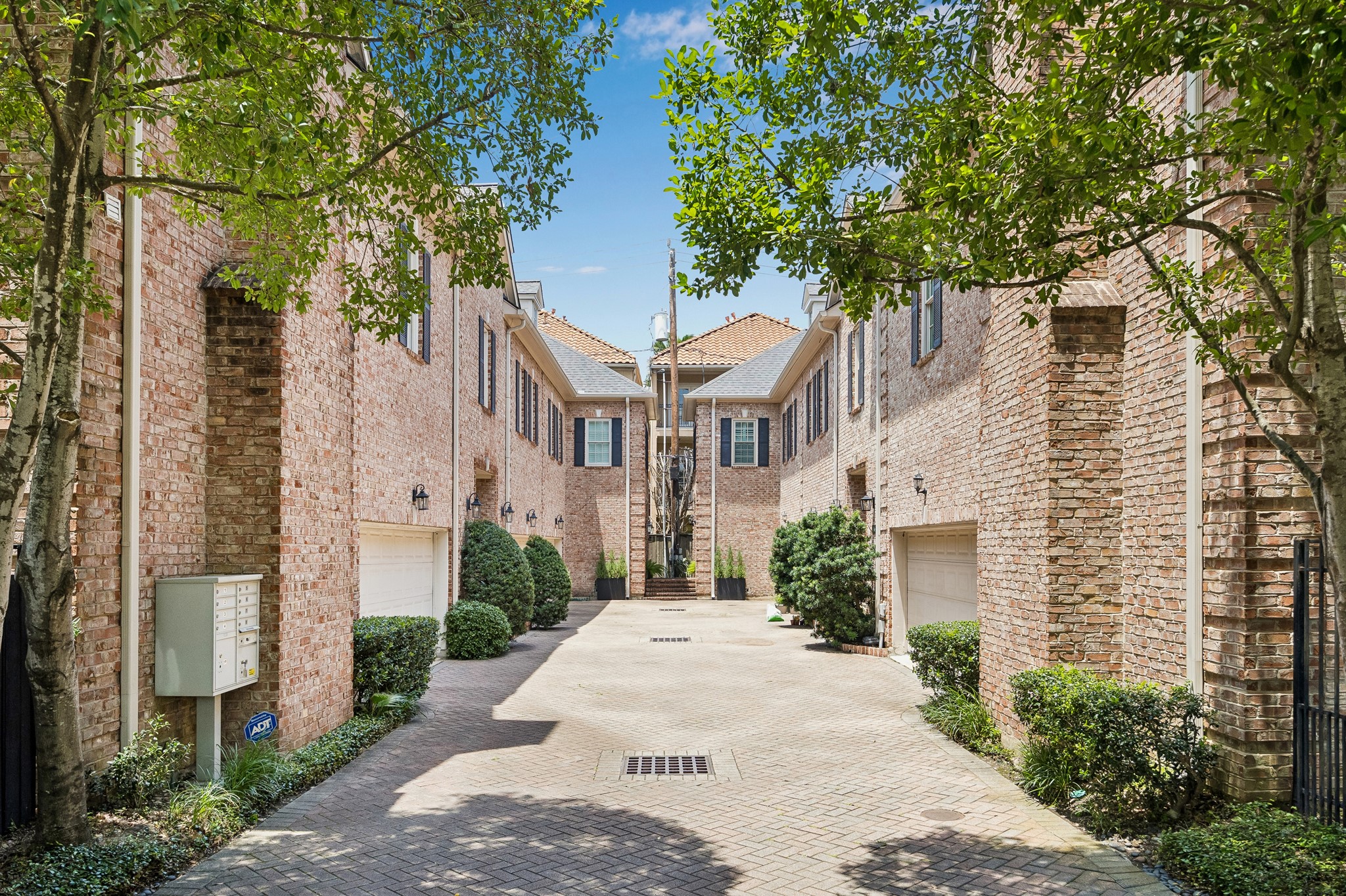 6022 Burgoyne Road Houston, TX 77057 - Photo 11 of 30 Beautifully maintained gated enclave with brick architecture, mature trees, and a welcoming neighborhood atmosphere.