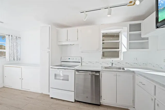a living room with a sink and a window