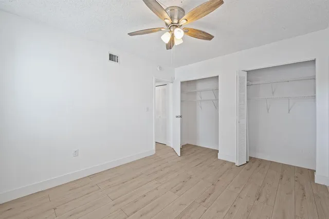 a view of deck with a floor to ceiling window next to a yard