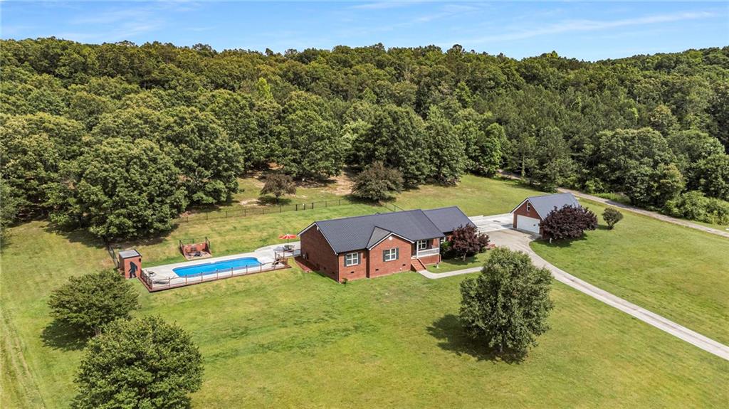 4986 Standifer Road Cohutta, GA 30710 - Photo 1 of 1 an aerial view of a house with outdoor space swimming pool