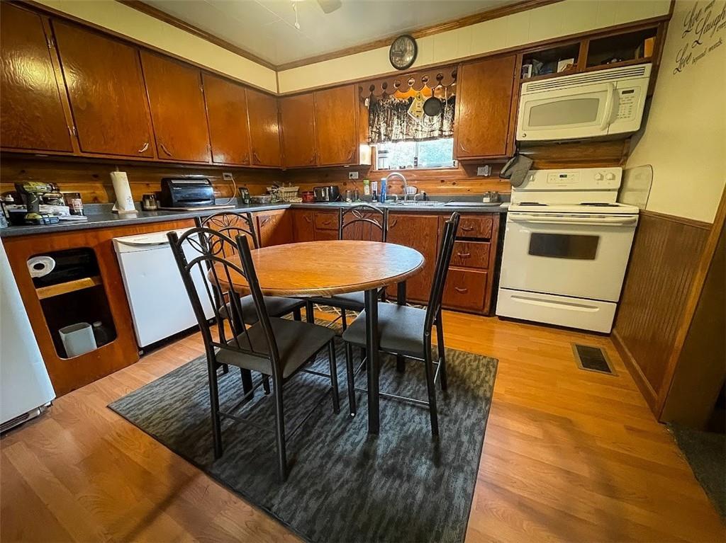 396 Game Reserve Road Butler, PA 16002 - Photo 5 of 20 a kitchen with stainless steel appliances granite countertop table chairs sink and cabinets