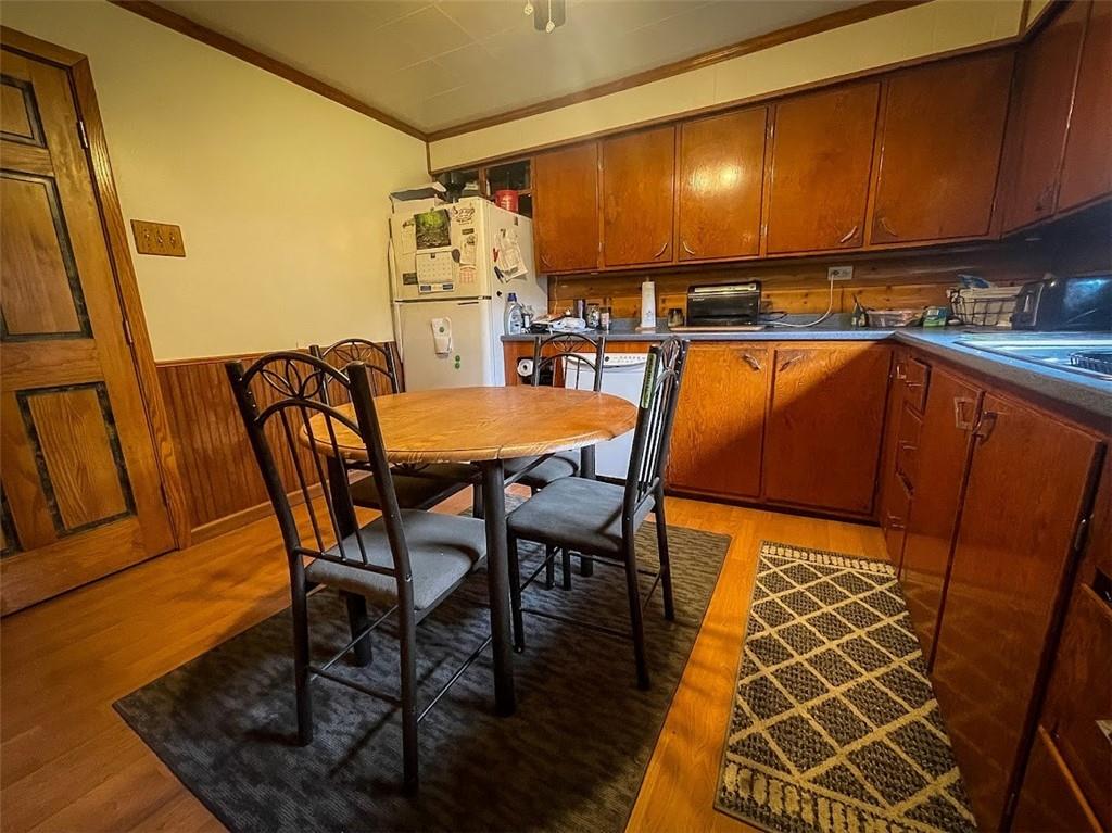 396 Game Reserve Road Butler, PA 16002 - Photo 6 of 20 a view of a dining room with furniture and wooden floor