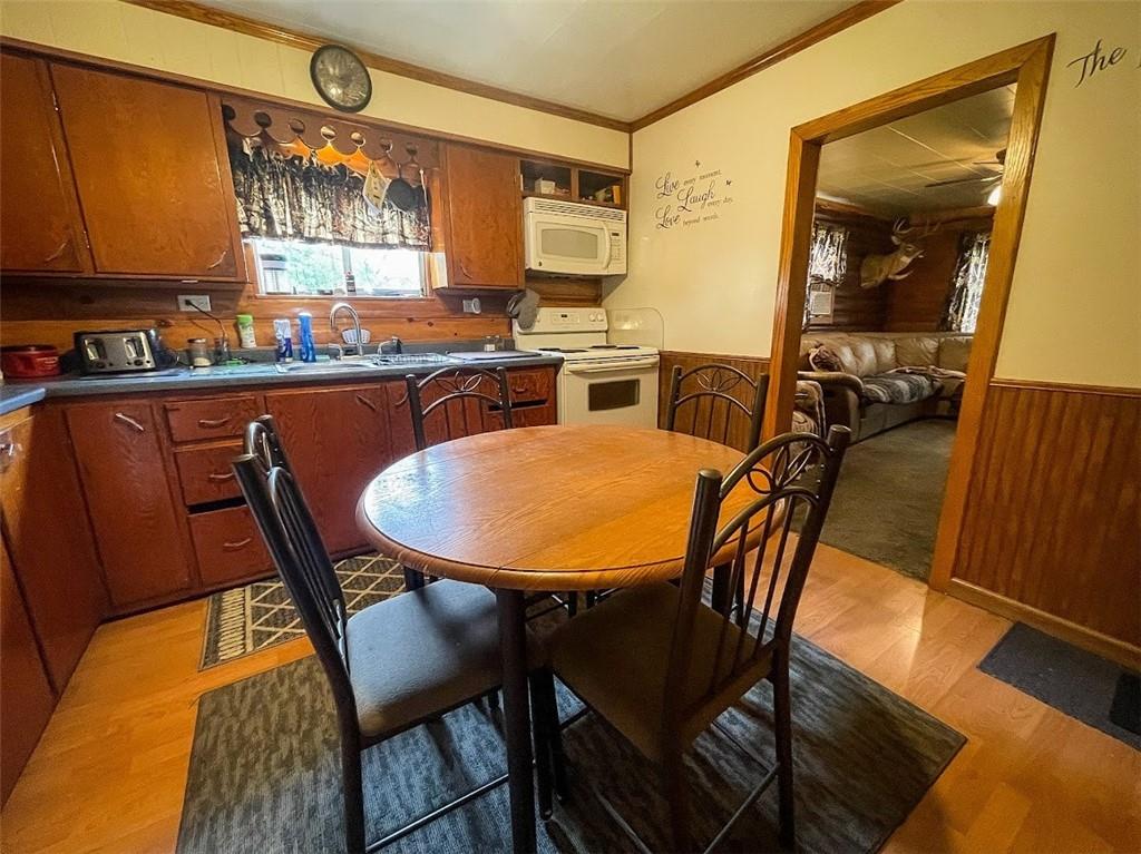 396 Game Reserve Road Butler, PA 16002 - Photo 8 of 20 a view of a dining room with furniture and wooden floor