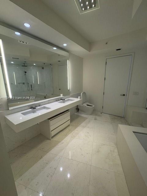 18555 Collins Avenue, Unit 2905 Sunny Isles Beach, FL 33160 - Photo 30 of 40 a bathroom with a sink and a mirror