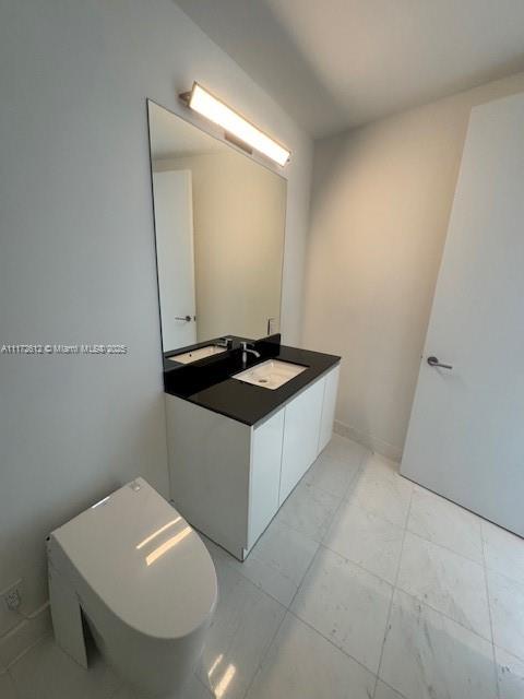 18555 Collins Avenue, Unit 2905 Sunny Isles Beach, FL 33160 - Photo 37 of 40 a bathroom with a sink and a mirror