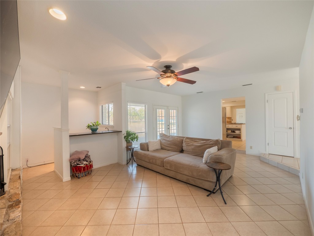 1822 Rowe Loop Pflugerville, TX 78660 - Photo 13 of 40 a living room with furniture and a chandelier