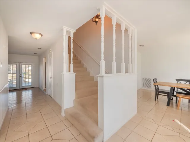 a view of a hallway with seating area