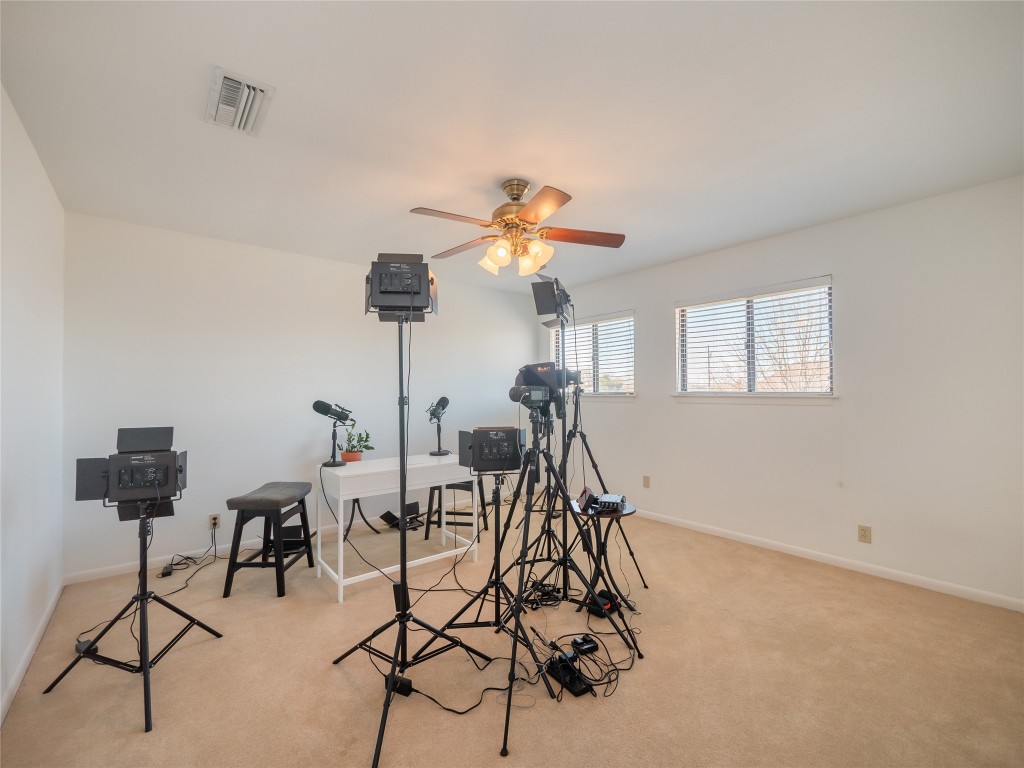 1822 Rowe Loop Pflugerville, TX 78660 - Photo 26 of 40 a view of a livingroom with furniture and a chandelier fan
