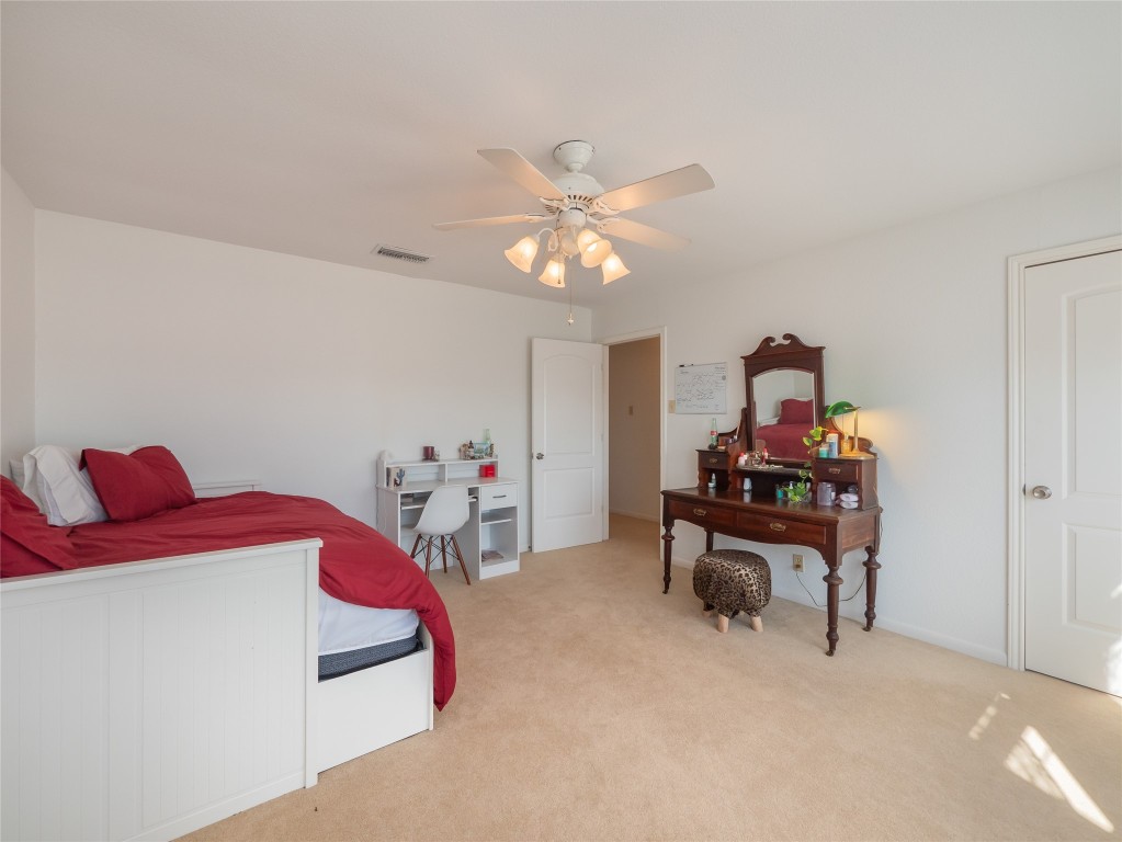 1822 Rowe Loop Pflugerville, TX 78660 - Photo 28 of 40 a living room with furniture and a chandelier