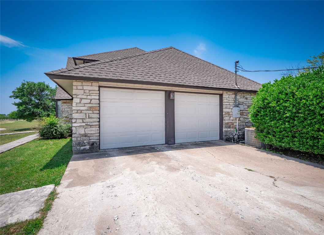 1822 Rowe Loop Pflugerville, TX 78660 - Photo 37 of 40 a front view of a house with a yard and garage