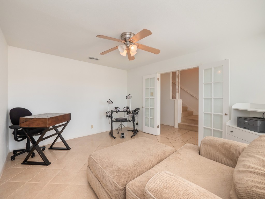 1822 Rowe Loop Pflugerville, TX 78660 - Photo 5 of 40 a living room with furniture a dining table and a fireplace