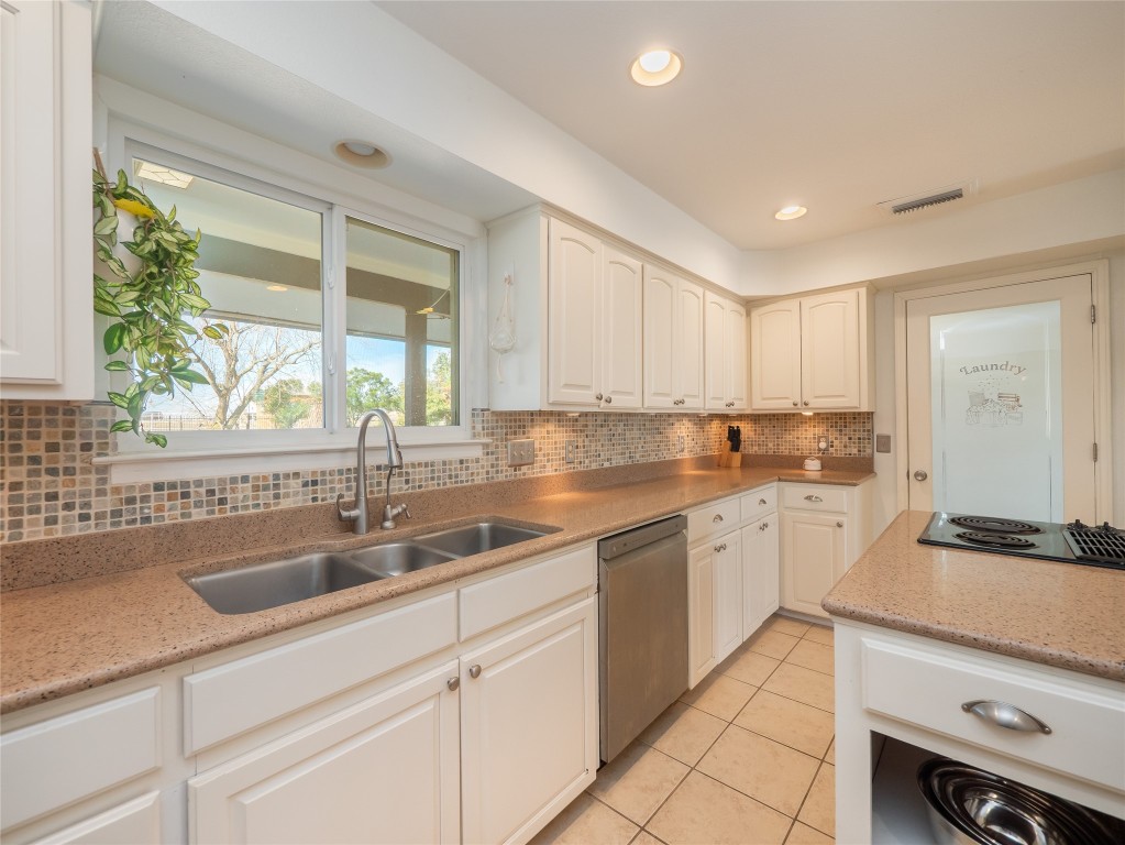 1822 Rowe Loop Pflugerville, TX 78660 - Photo 9 of 40 a kitchen with sink and cabinets