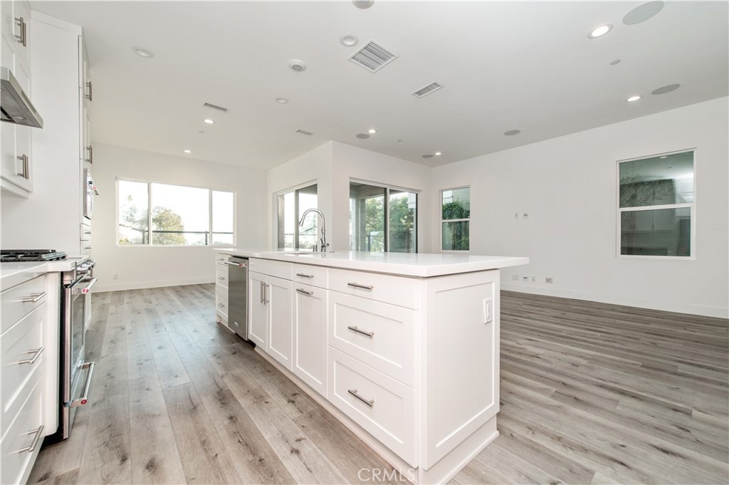 26380 Paseo Sillin San Juan Capistrano, CA 92675 - Photo 13 of 49 a kitchen with white cabinets and sink