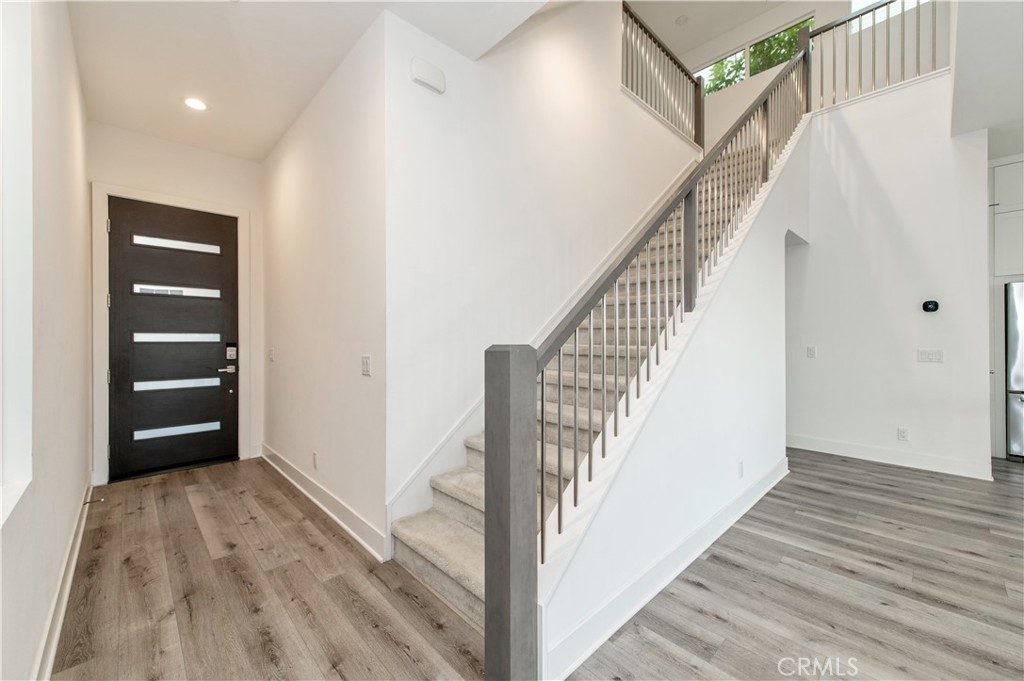 26380 Paseo Sillin San Juan Capistrano, CA 92675 - Photo 17 of 49 a view of a hallway with wooden floor and entryway