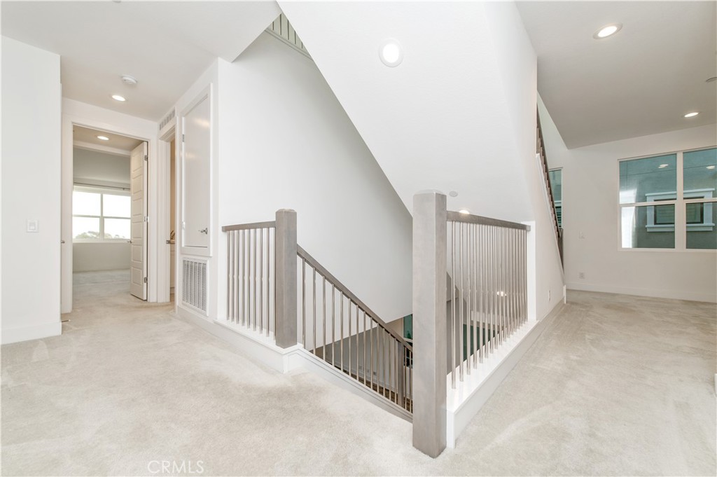 26380 Paseo Sillin San Juan Capistrano, CA 92675 - Photo 25 of 49 a view of a hallway with white walls and windows
