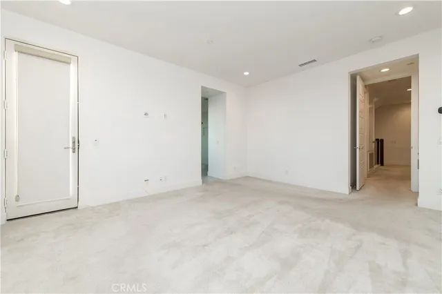 an empty room with closet area