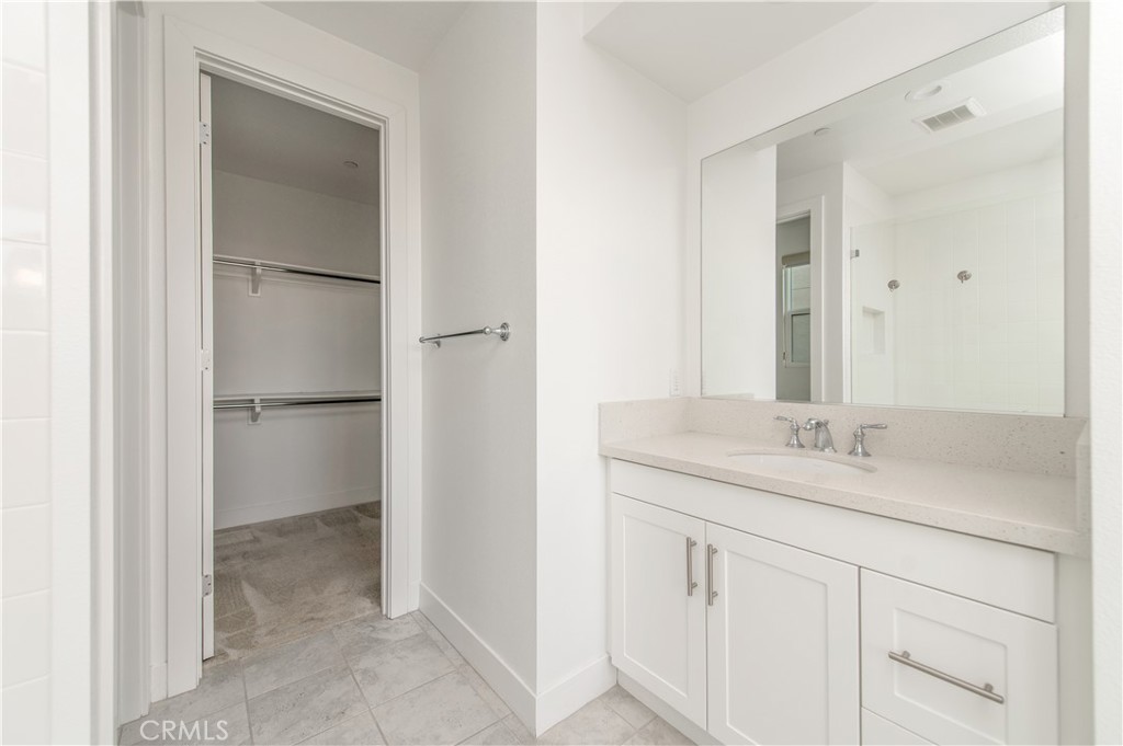 26380 Paseo Sillin San Juan Capistrano, CA 92675 - Photo 29 of 49 a bathroom with a granite countertop sink and a mirror