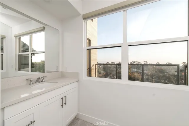 a bathroom with a sink and a large window