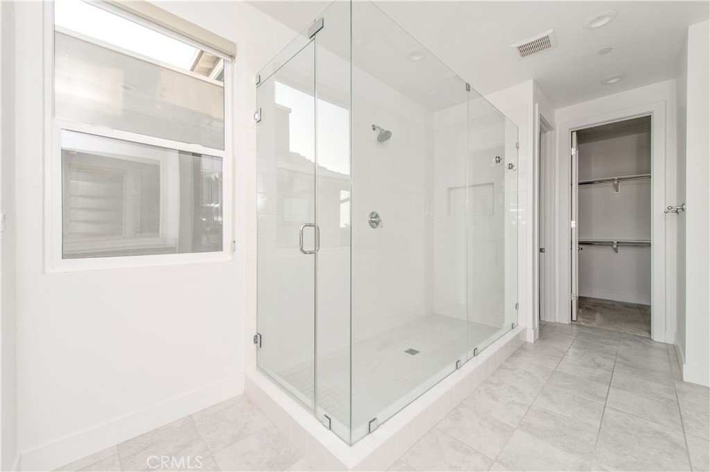 26380 Paseo Sillin San Juan Capistrano, CA 92675 - Photo 31 of 49 a bathroom with a shower and a glass door