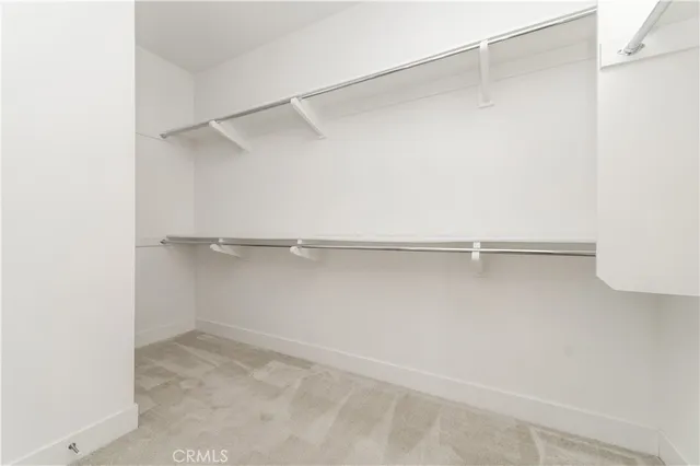 a view of an empty walk in closet