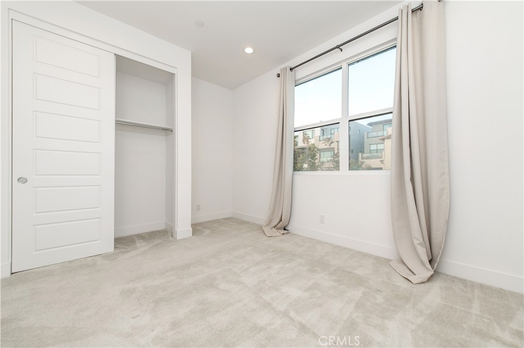 26380 Paseo Sillin San Juan Capistrano, CA 92675 - Photo 34 of 49 an empty room with windows