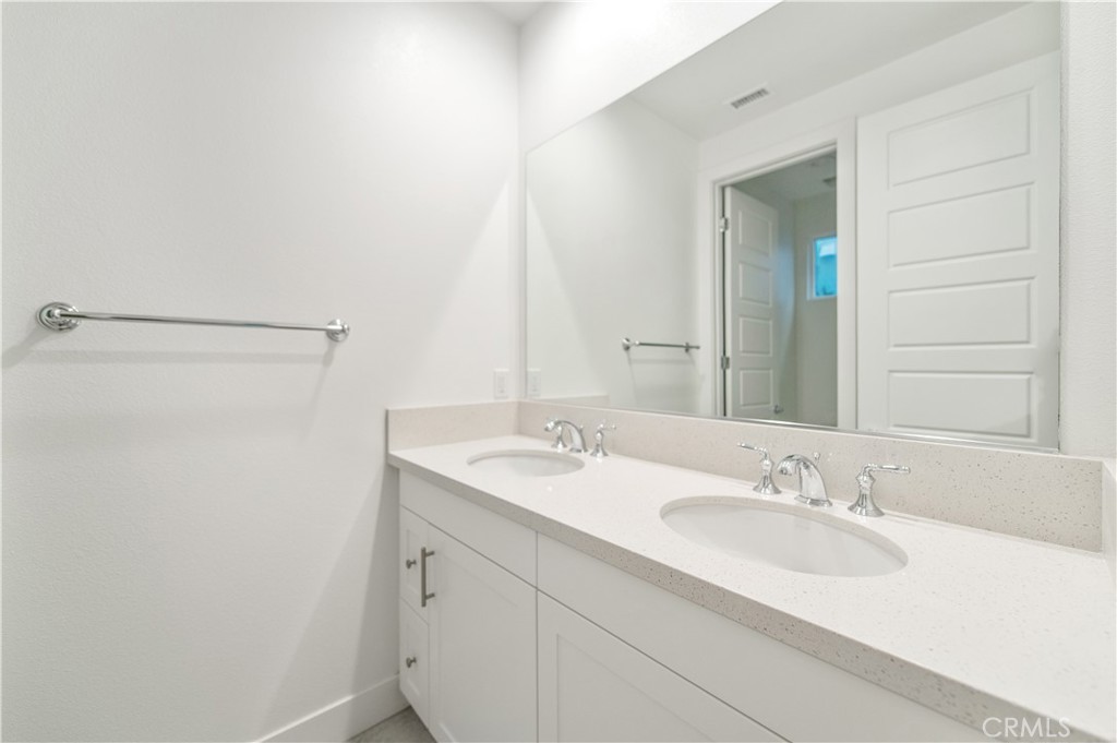 26380 Paseo Sillin San Juan Capistrano, CA 92675 - Photo 37 of 49 a bathroom with a sink and a mirror