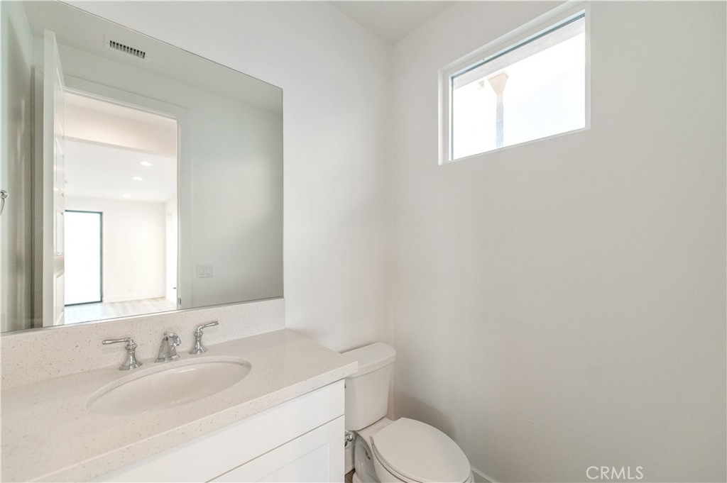 26380 Paseo Sillin San Juan Capistrano, CA 92675 - Photo 41 of 49 a bathroom with a toilet sink and mirror