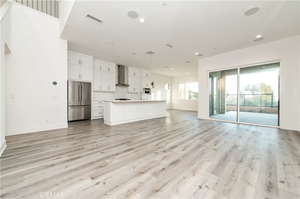 26380 Paseo Sillin San Juan Capistrano, CA 92675 - Photo 7 of 49 a view of kitchen with wooden floor and electronic appliances