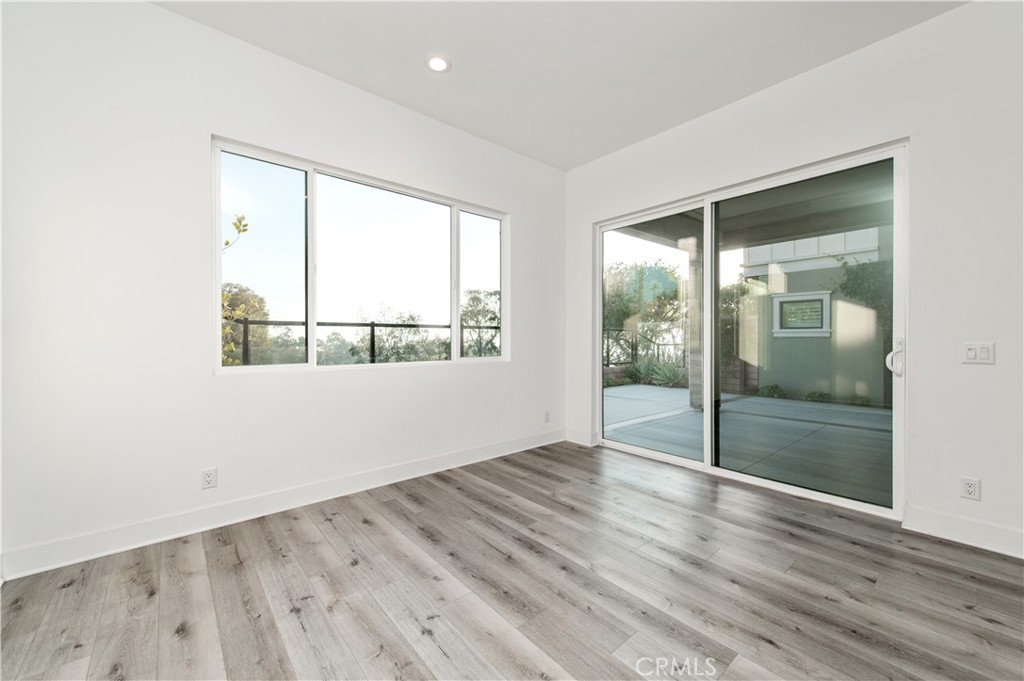26380 Paseo Sillin San Juan Capistrano, CA 92675 - Photo 9 of 49 an empty room with wooden floor and windows