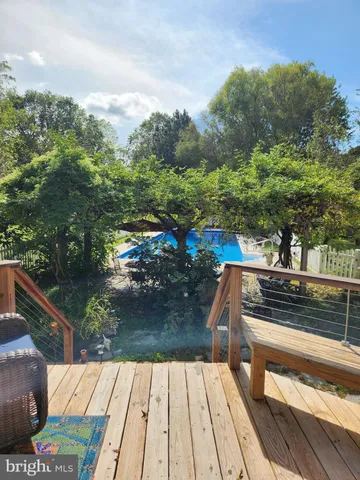 a view of balcony with wooden floor and outdoor space