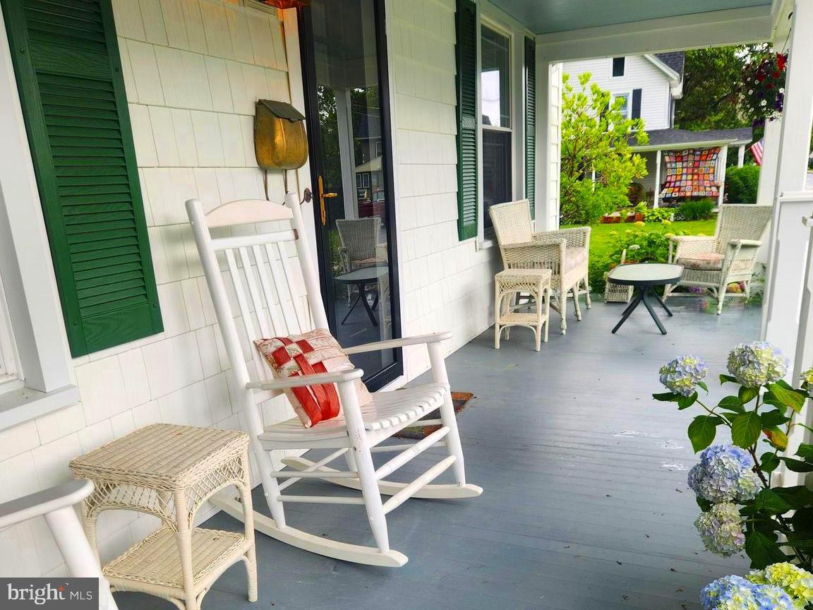 101 Washington Street Berlin, MD 21811 - Photo 2 of 22 a backyard of a house with outdoor seating