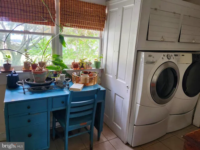 a room with wooden floor and furniture
