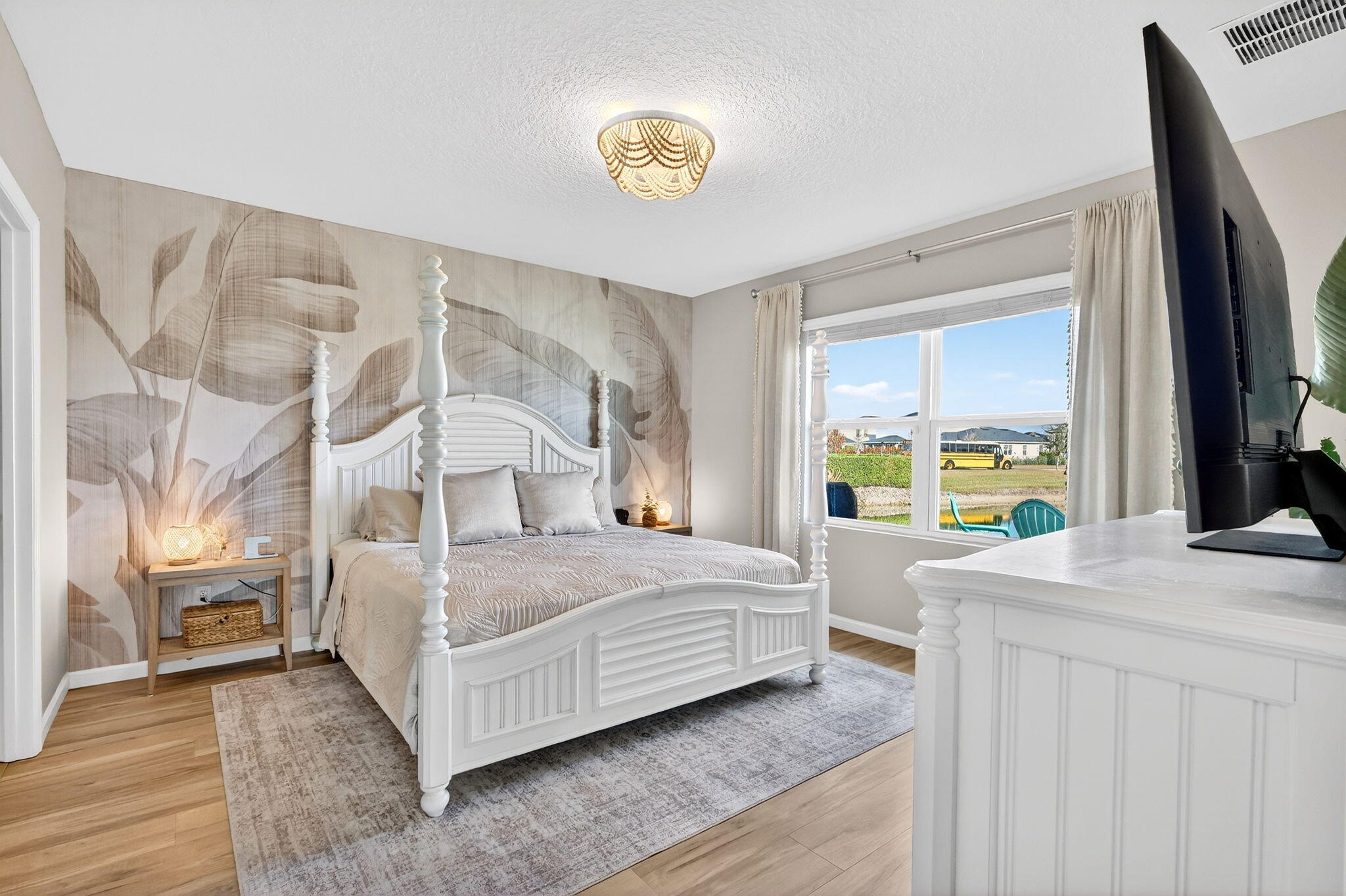 10897 Pacini Way Port St. Lucie, FL 34987 - Photo 11 of 35 a bedroom with a bed and a large window