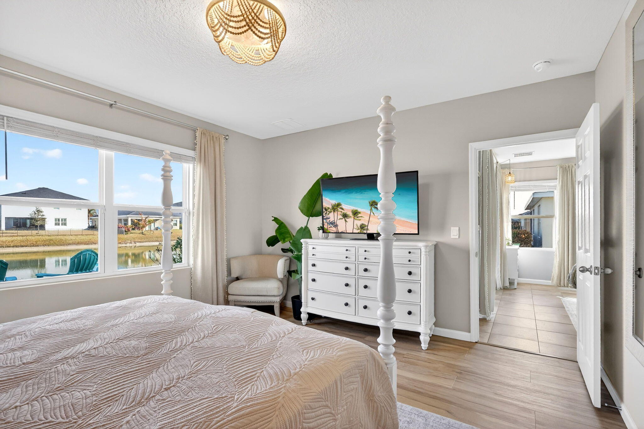 10897 Pacini Way Port St. Lucie, FL 34987 - Photo 12 of 35 a bedroom with a bed and a dresser