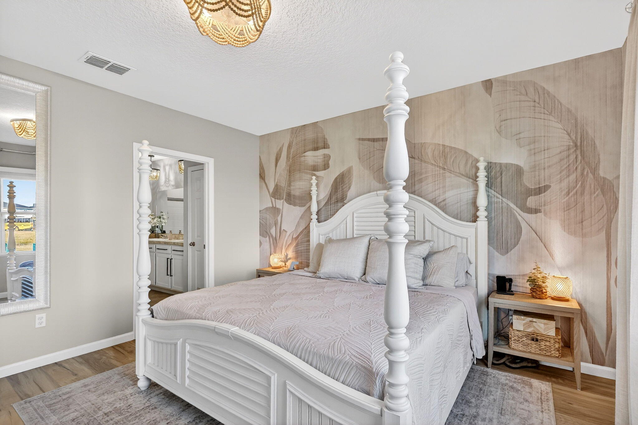 10897 Pacini Way Port St. Lucie, FL 34987 - Photo 13 of 35 a bedroom with a bed and a chandelier