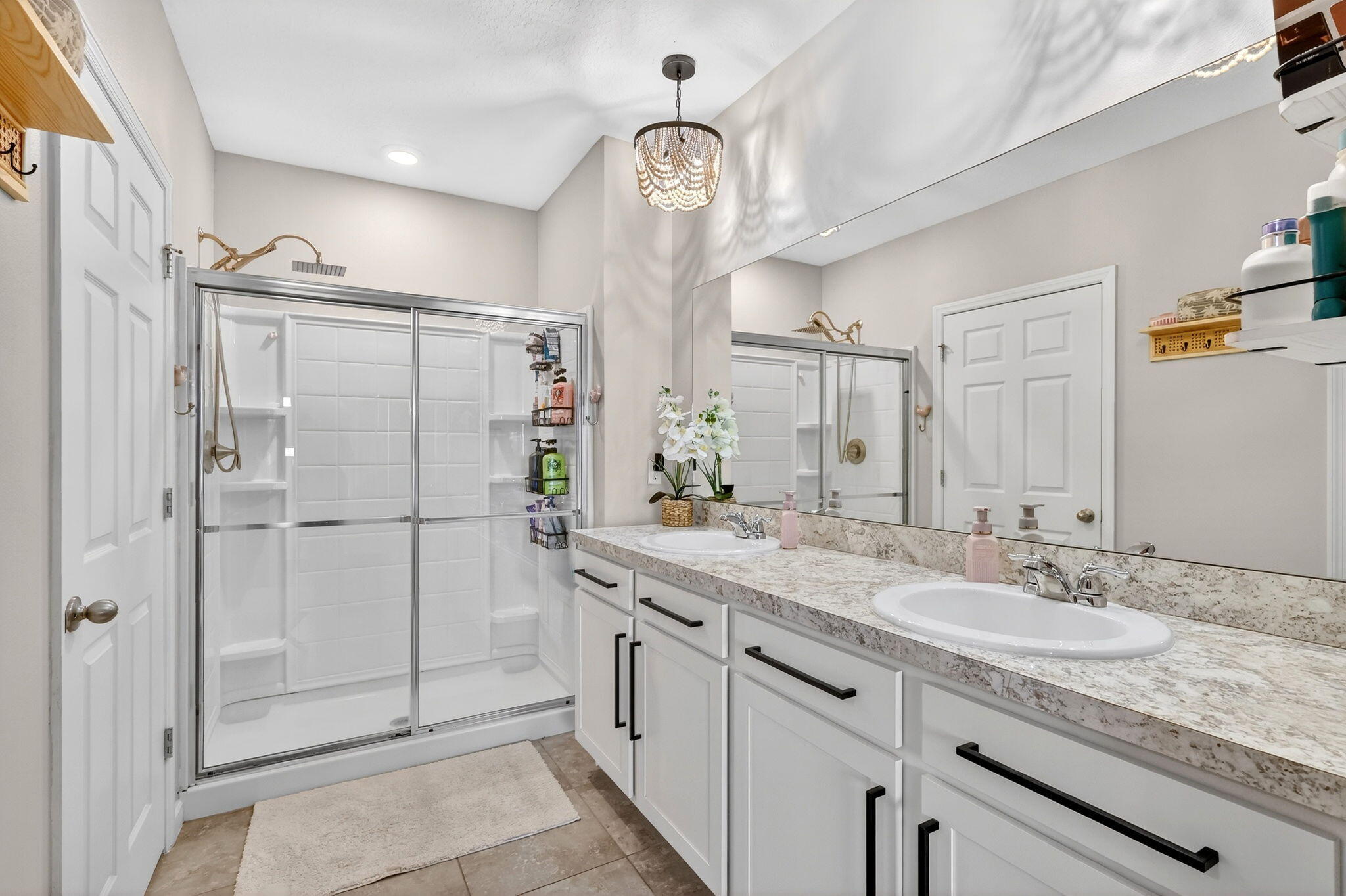 10897 Pacini Way Port St. Lucie, FL 34987 - Photo 14 of 35 a bathroom with a granite countertop sink mirror and a shower