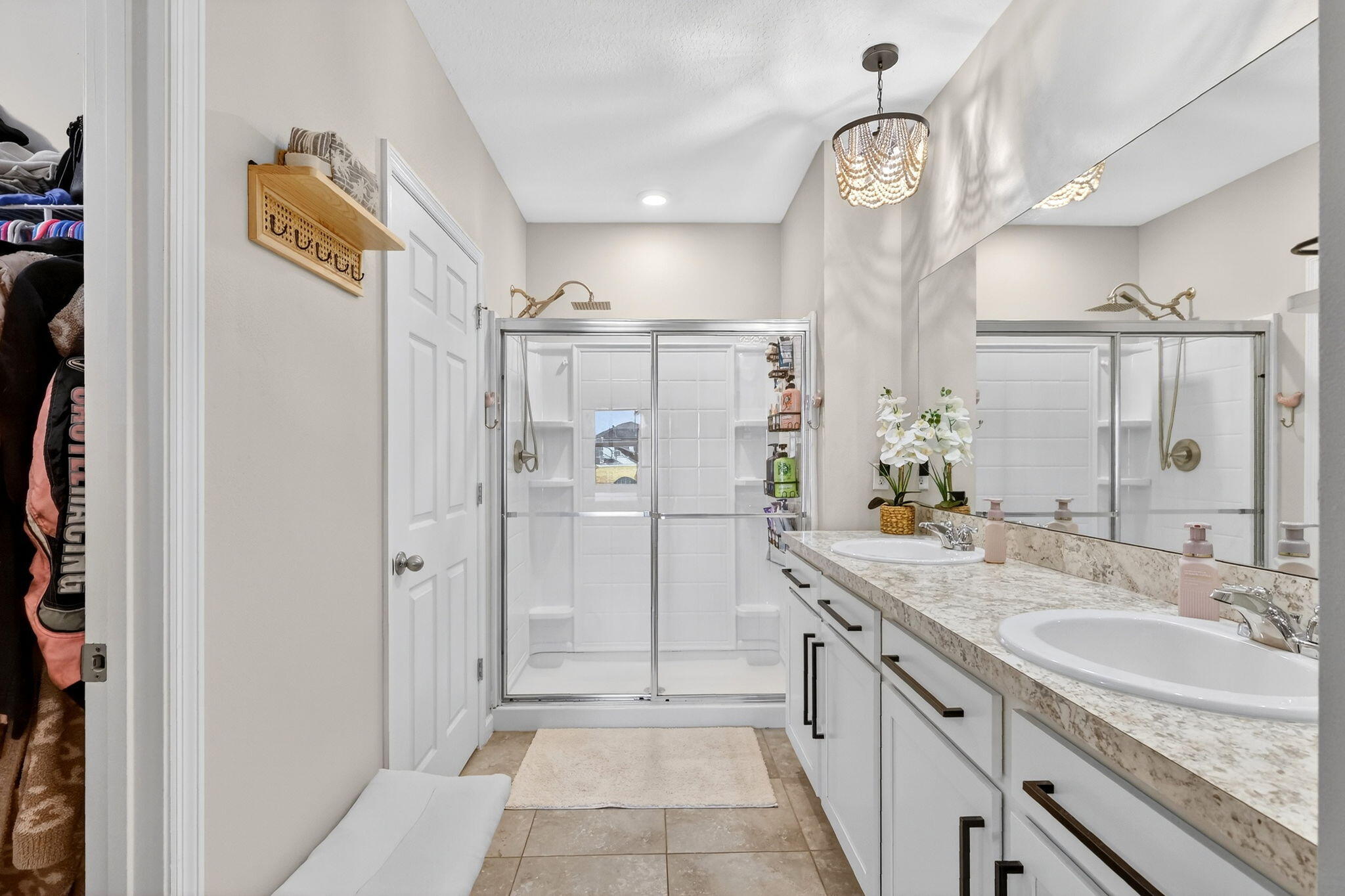 10897 Pacini Way Port St. Lucie, FL 34987 - Photo 15 of 35 a spacious bathroom with a shower sink and mirror
