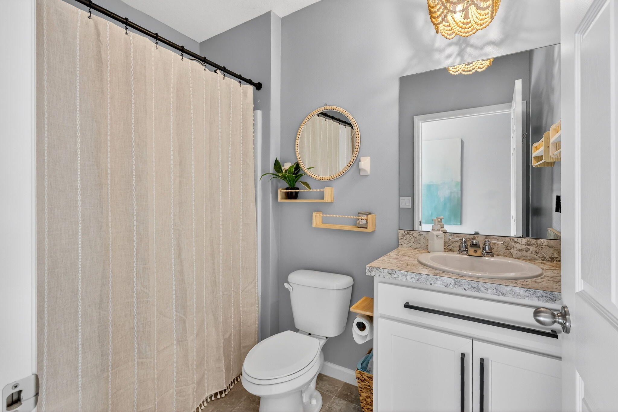 10897 Pacini Way Port St. Lucie, FL 34987 - Photo 17 of 35 a bathroom with a granite countertop toilet sink and mirror