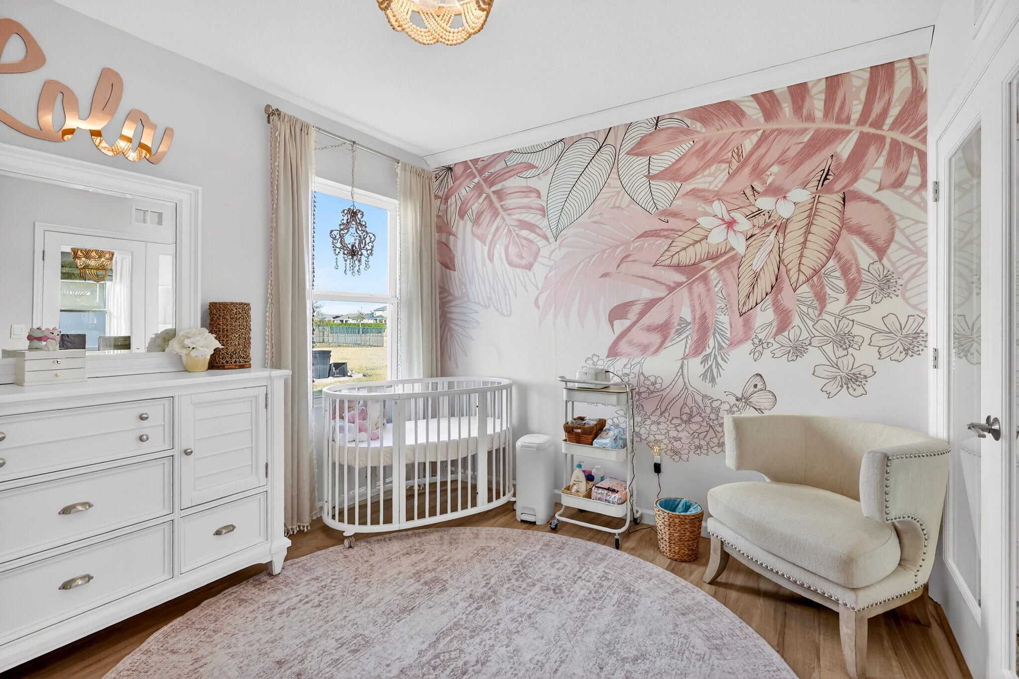 10897 Pacini Way Port St. Lucie, FL 34987 - Photo 18 of 35 a bedroom with a baby bed a couch and two windows