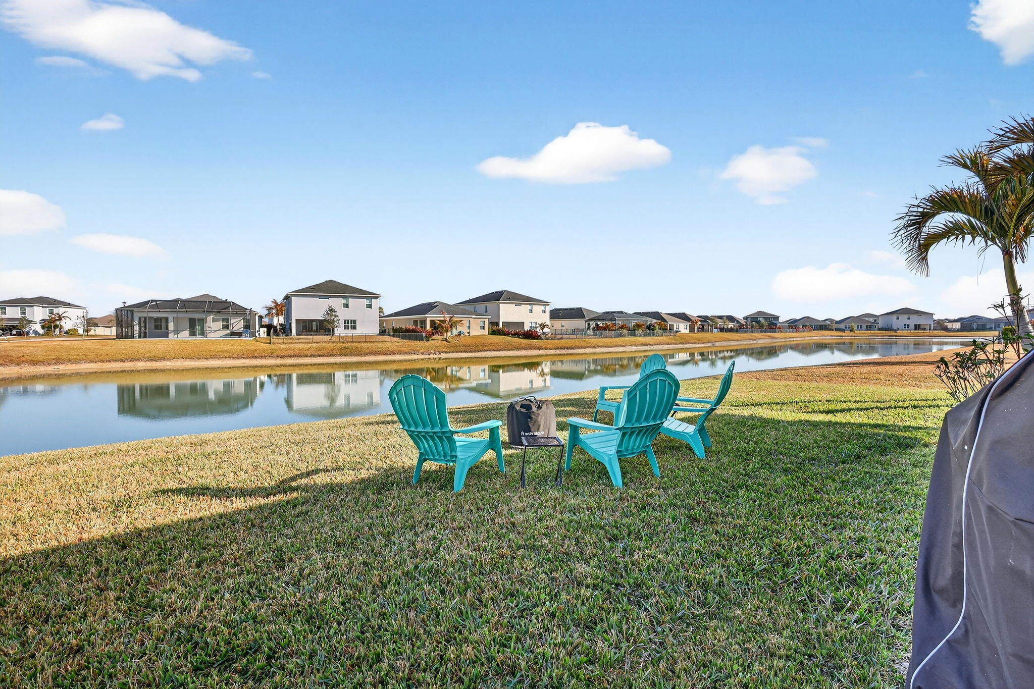10897 Pacini Way Port St. Lucie, FL 34987 - Photo 25 of 35 a view of a lake with table and chairs