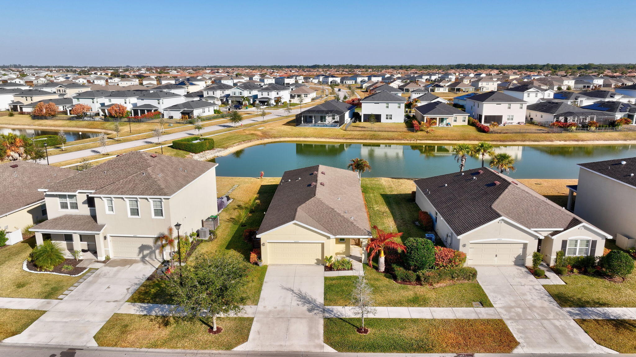10897 Pacini Way Port St. Lucie, FL 34987 - Photo 27 of 35 an aerial view of residential houses with outdoor space