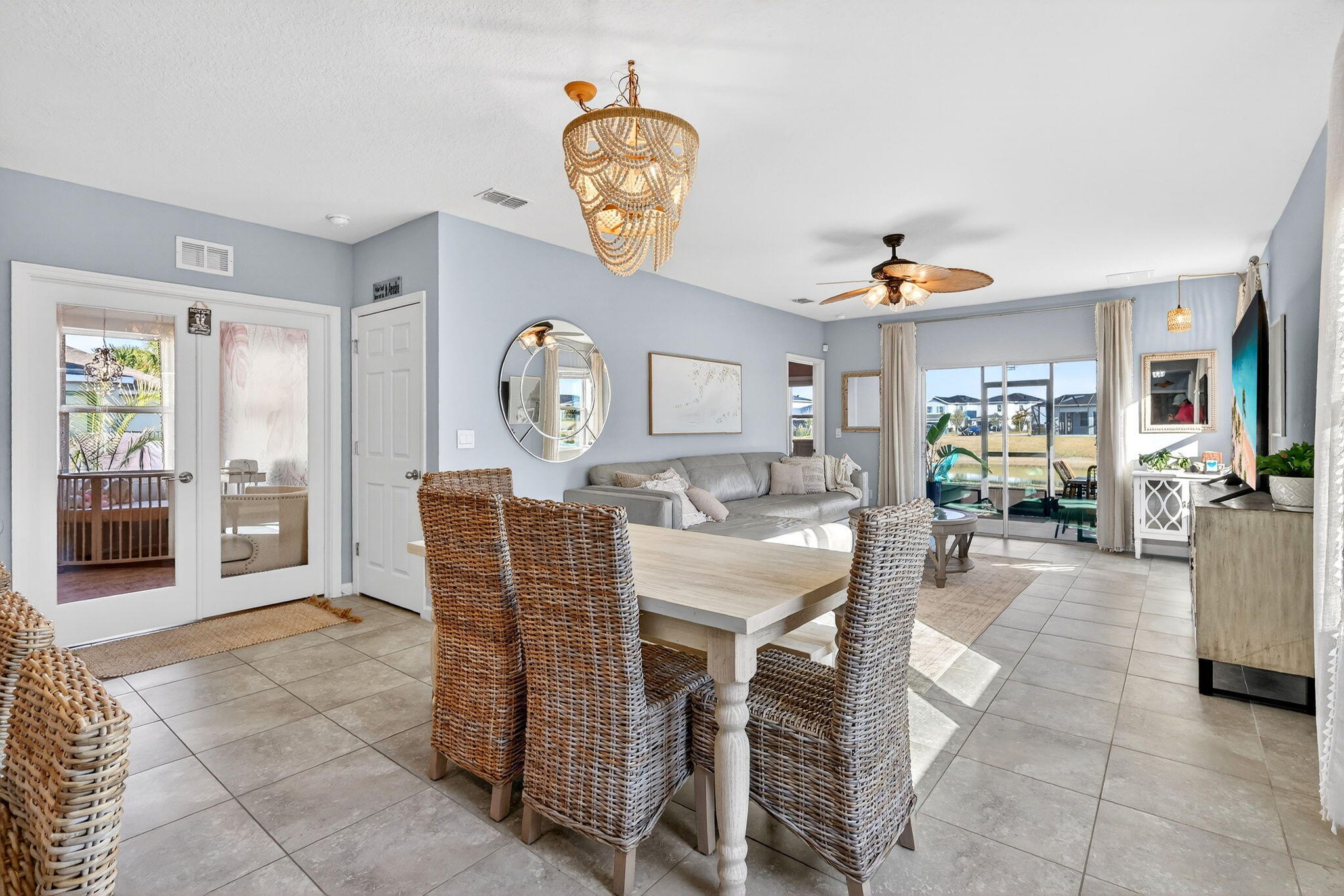 10897 Pacini Way Port St. Lucie, FL 34987 - Photo 7 of 35 a dining room with furniture and a clock
