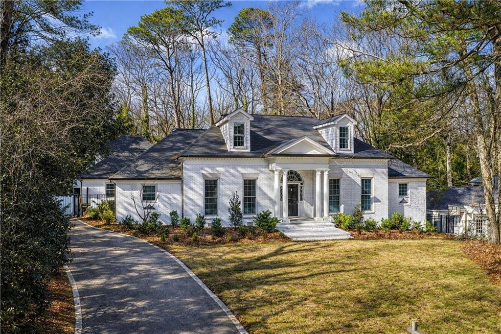 1330 West Wesley Road Northwest Atlanta, GA 30327 - Photo 1 of 46 a front view of house with yard