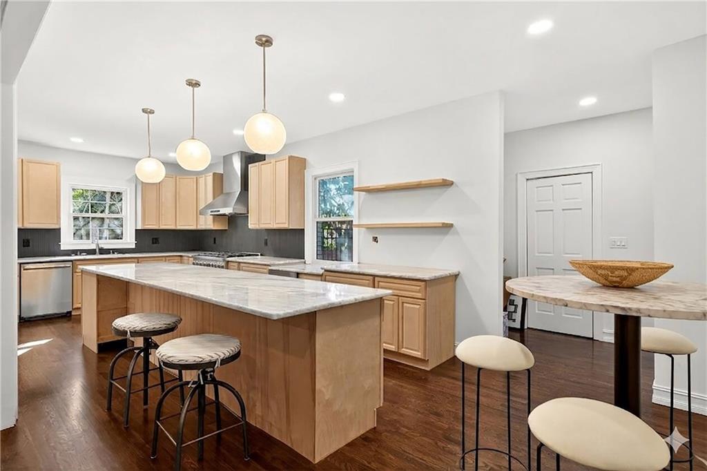 1330 West Wesley Road Northwest Atlanta, GA 30327 - Photo 13 of 46 a kitchen with a table chairs sink and cabinets
